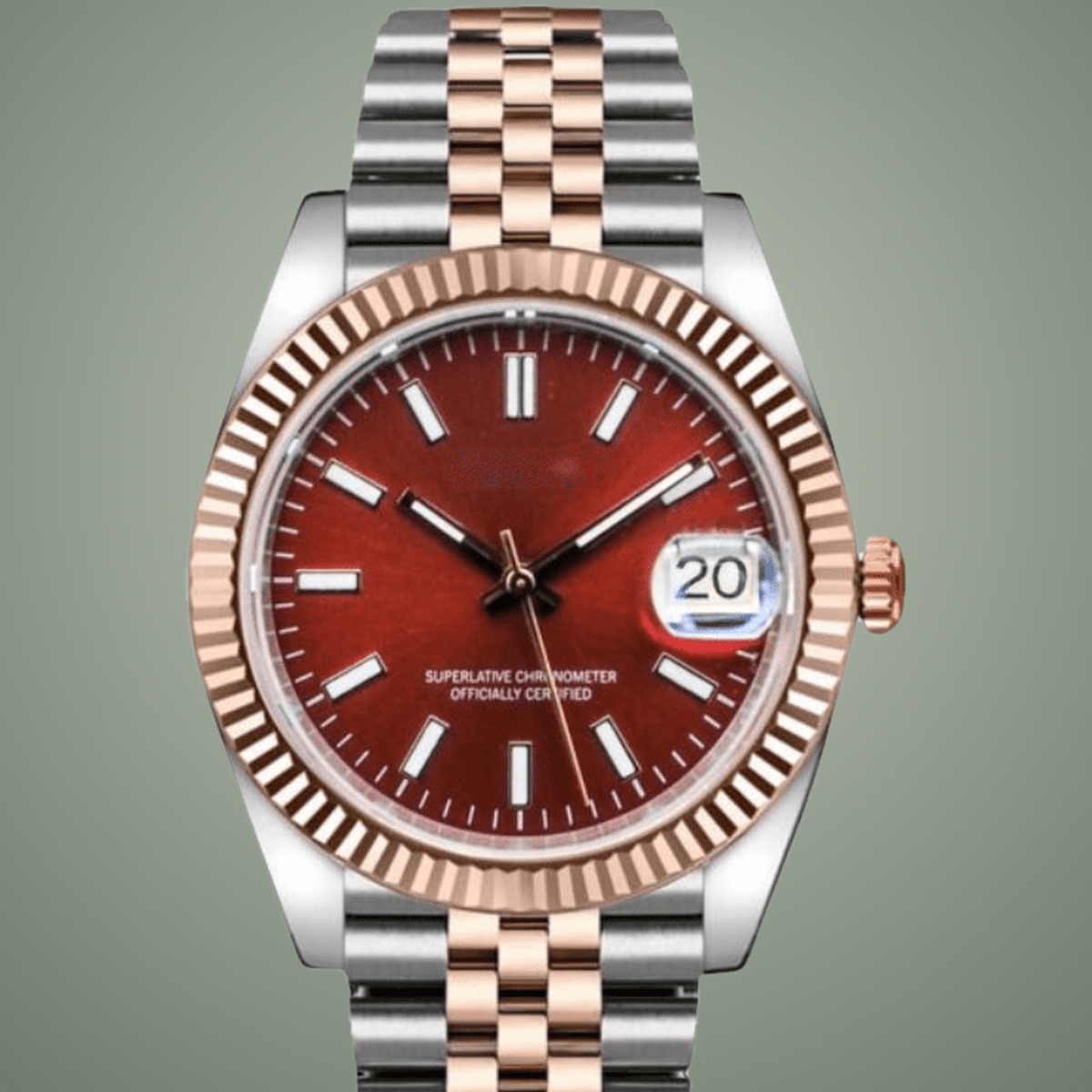 Close-up of the burgundy-red dial, magnified date window, and rose-gold fluted bezel on the Crownline Date.