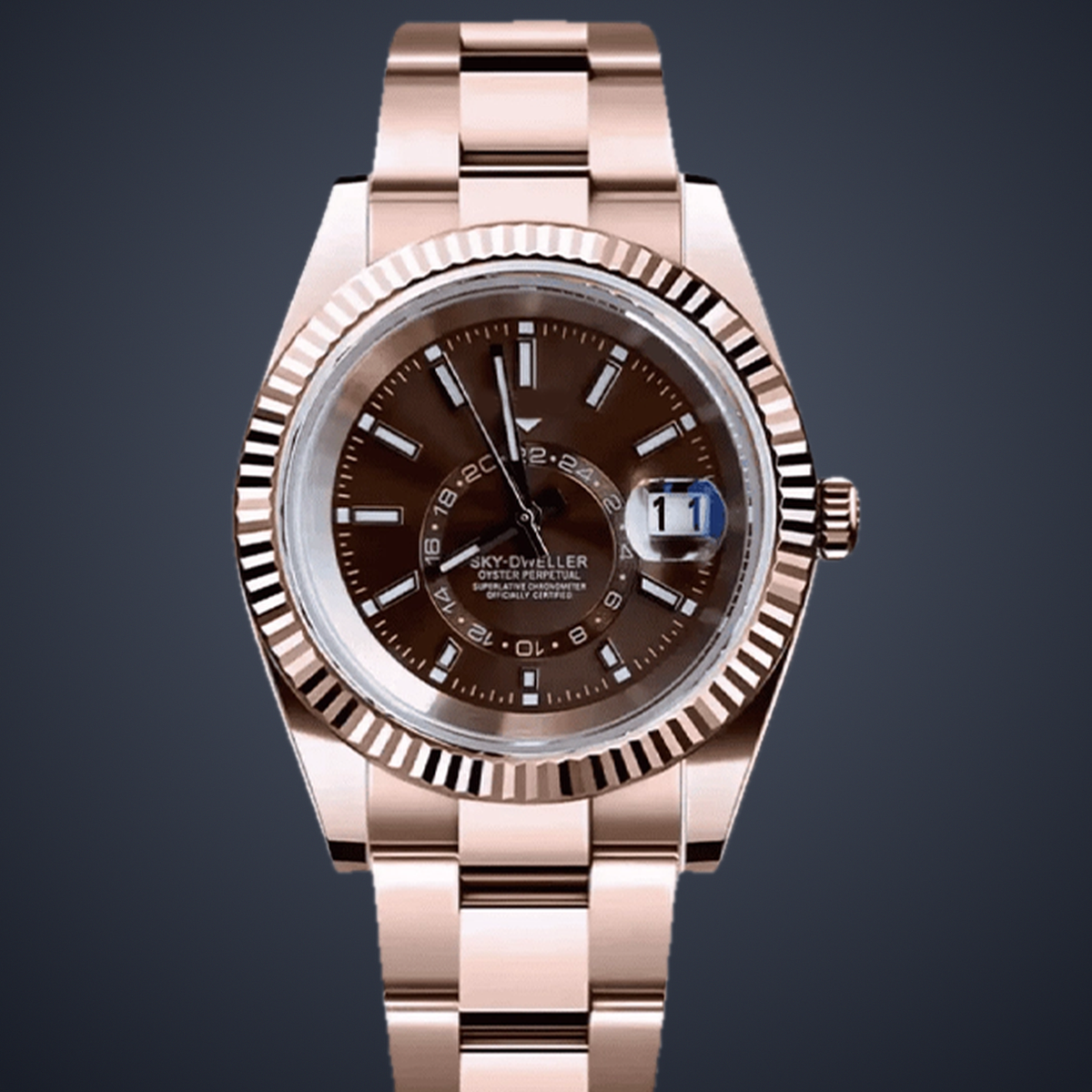 Close-up of the champagne-brown calendar dial, magnified date window, and rose-gold case and bezel on the Celestial Calendar.