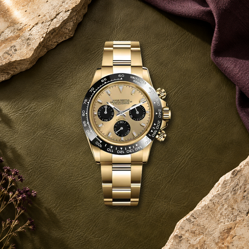 Speedline Gold and Champagne chronograph laid flat on olive leather with plum textile