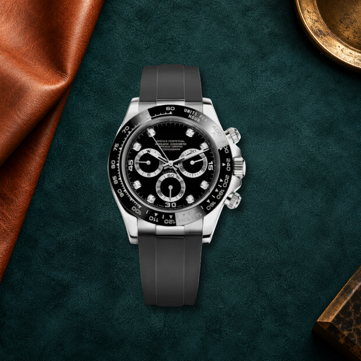 Speedline Gem Black chronograph laid flat on deep teal suede with cognac leather