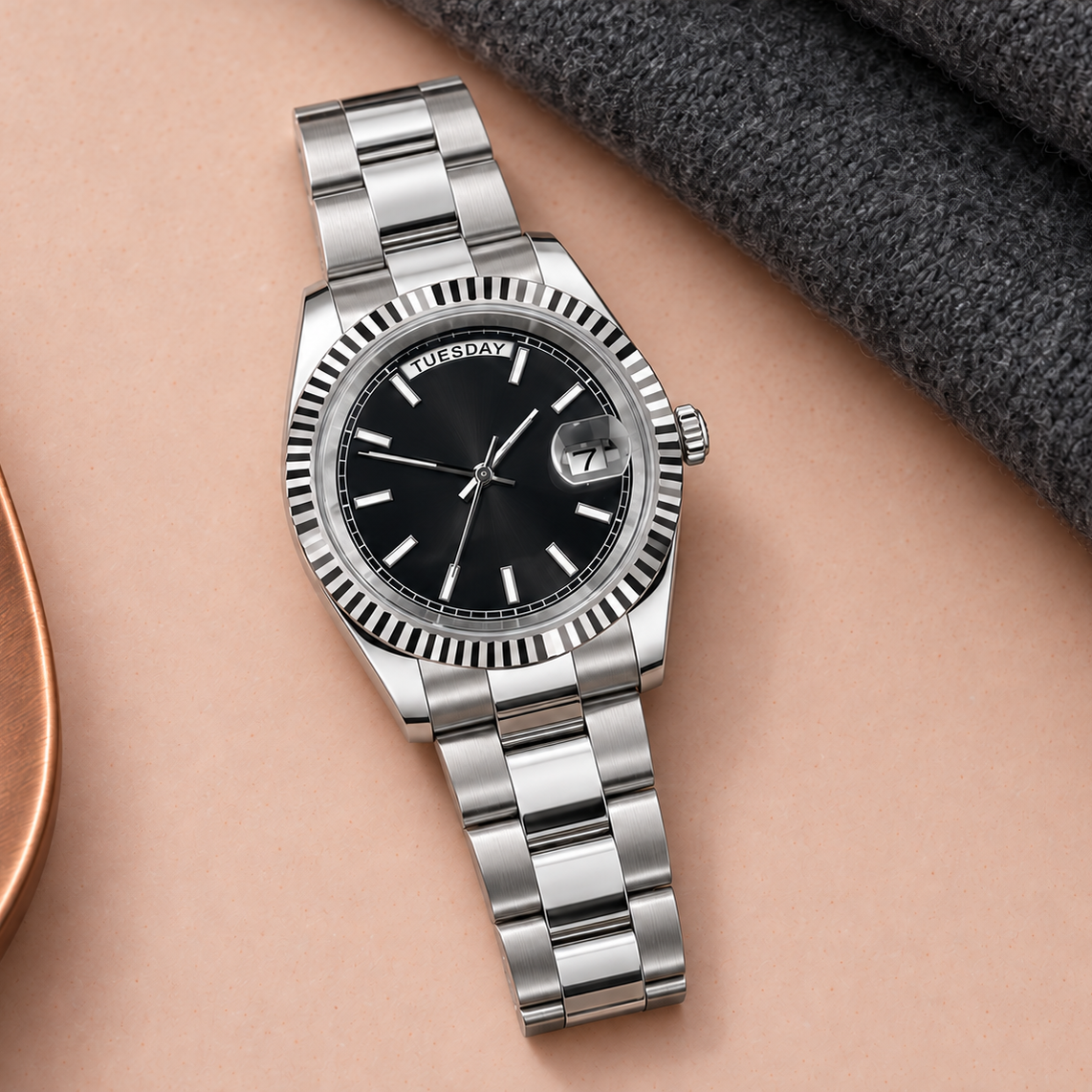 Dayline Stealth Black three-wide-link bracelet on apricot ceramic