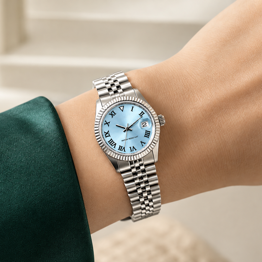 Lady Crownline ice-blue Roman watch with date 2 worn with a deep-green sleeve