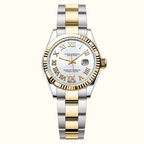 A two-tone stainless steel and gold wristwatch with a white dial, Roman numeral hour markers, a fluted gold-tone bezel, and an Oyster Perpetual Laurel Coast automatic crown.