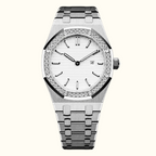 A luxury stainless steel wristwatch with a white dial, a bezel encrusted with clear crystals, and a matching steel link bracelet, shown against a plain white background.
