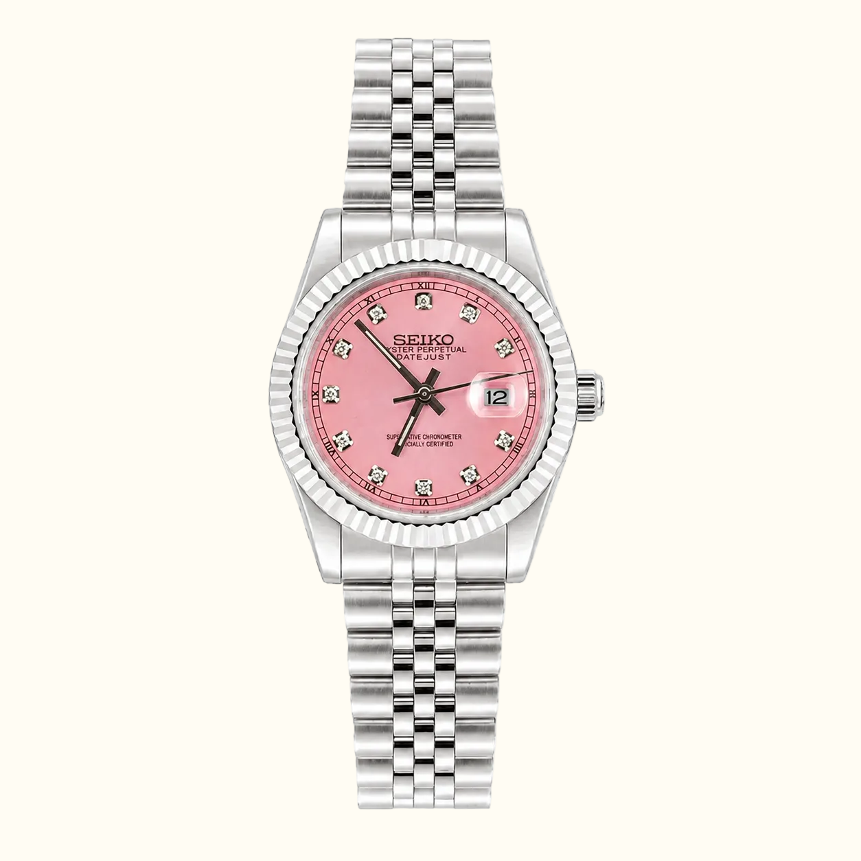 A Seiko women's watch featuring a silver-tone stainless steel Jubilee bracelet, a fluted bezel, and a pink dial with crystal hour markers.