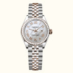  women's Day-Date watch with a two-tone stainless steel and rose gold Oyster bracelet, a white mother-of-pearl dial with Roman numerals, and a bezel set with clear crystals.