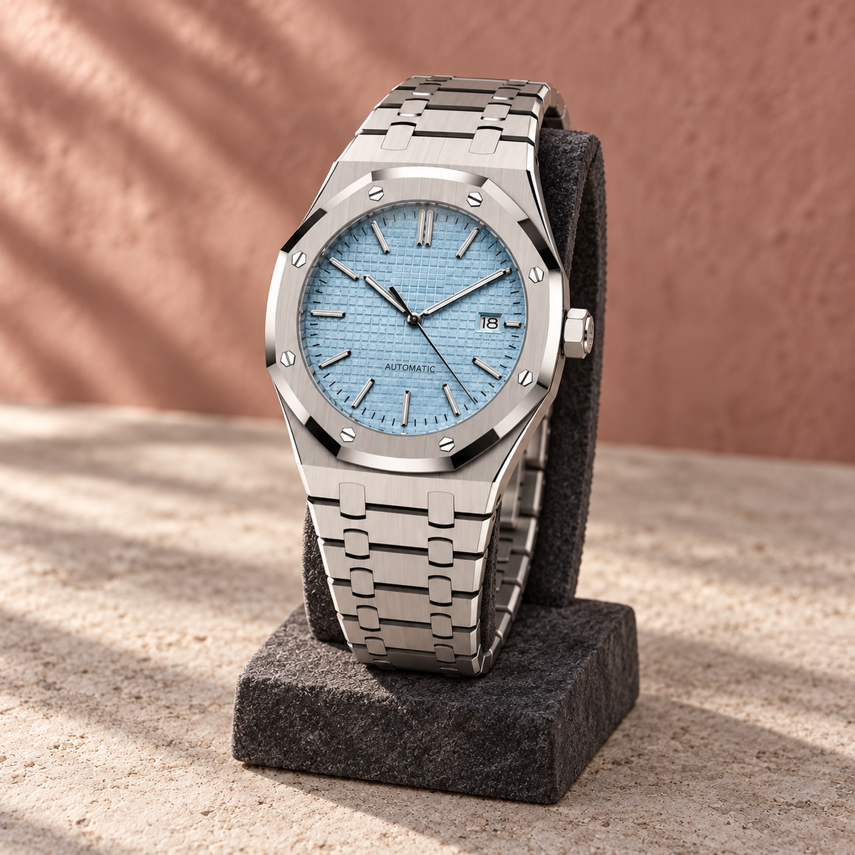 Aqua blue Royal Sportline watch displayed on a charcoal stone stand