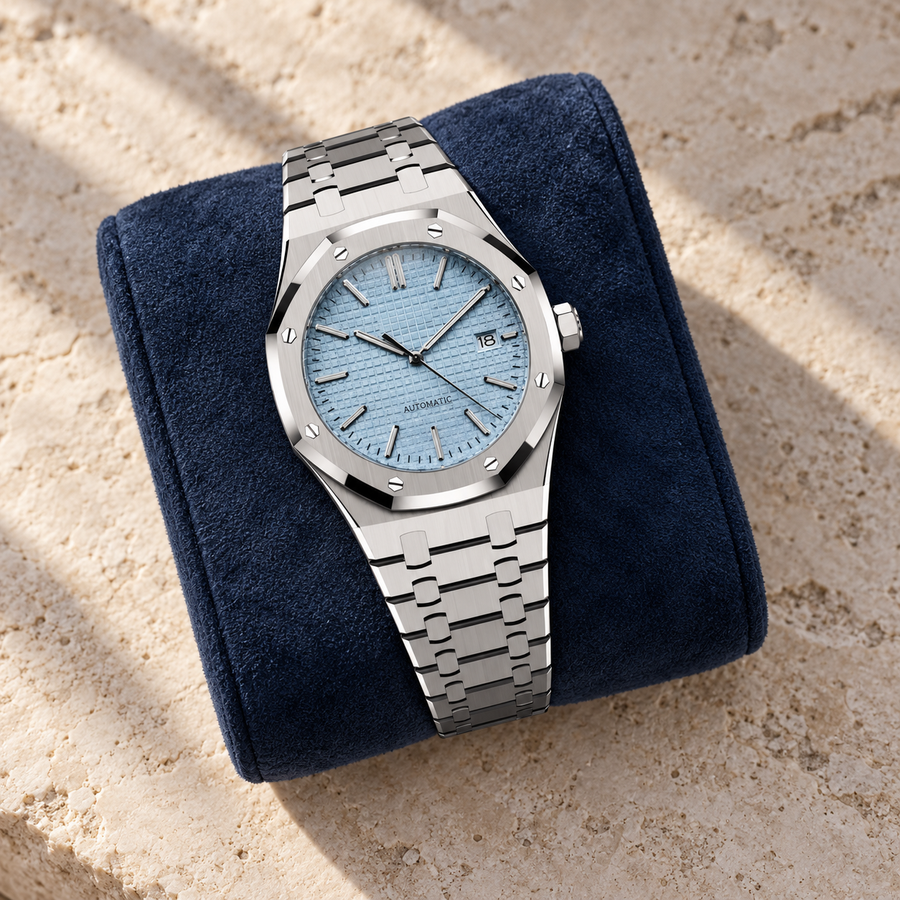 Aqua blue Royal Sportline watch on a navy suede cushion and limestone