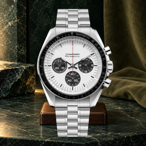 Speedline Chronograph Apollo white panda dial on a walnut stand against forest-green stone