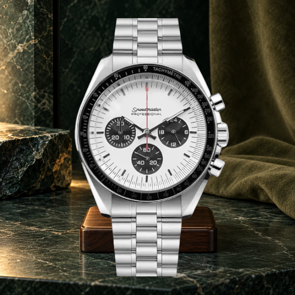 Speedline Chronograph Apollo white panda dial on a walnut stand against forest-green stone
