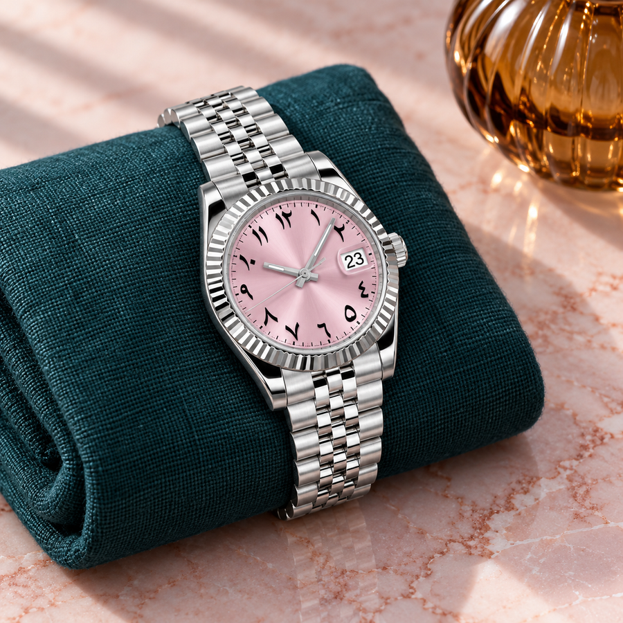 Blush pink Arabic dial watch on dusty rose velvet in cream travertine tray