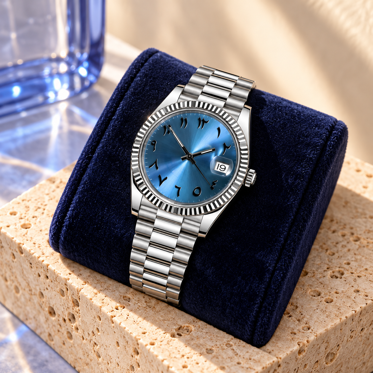 Deep ice-blue Arabic numeral watch on indigo velvet over apricot travertine
