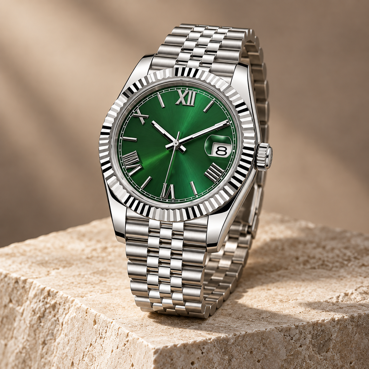 Forest-green Roman numeral date watch with Jubilee bracelet on pale limestone
