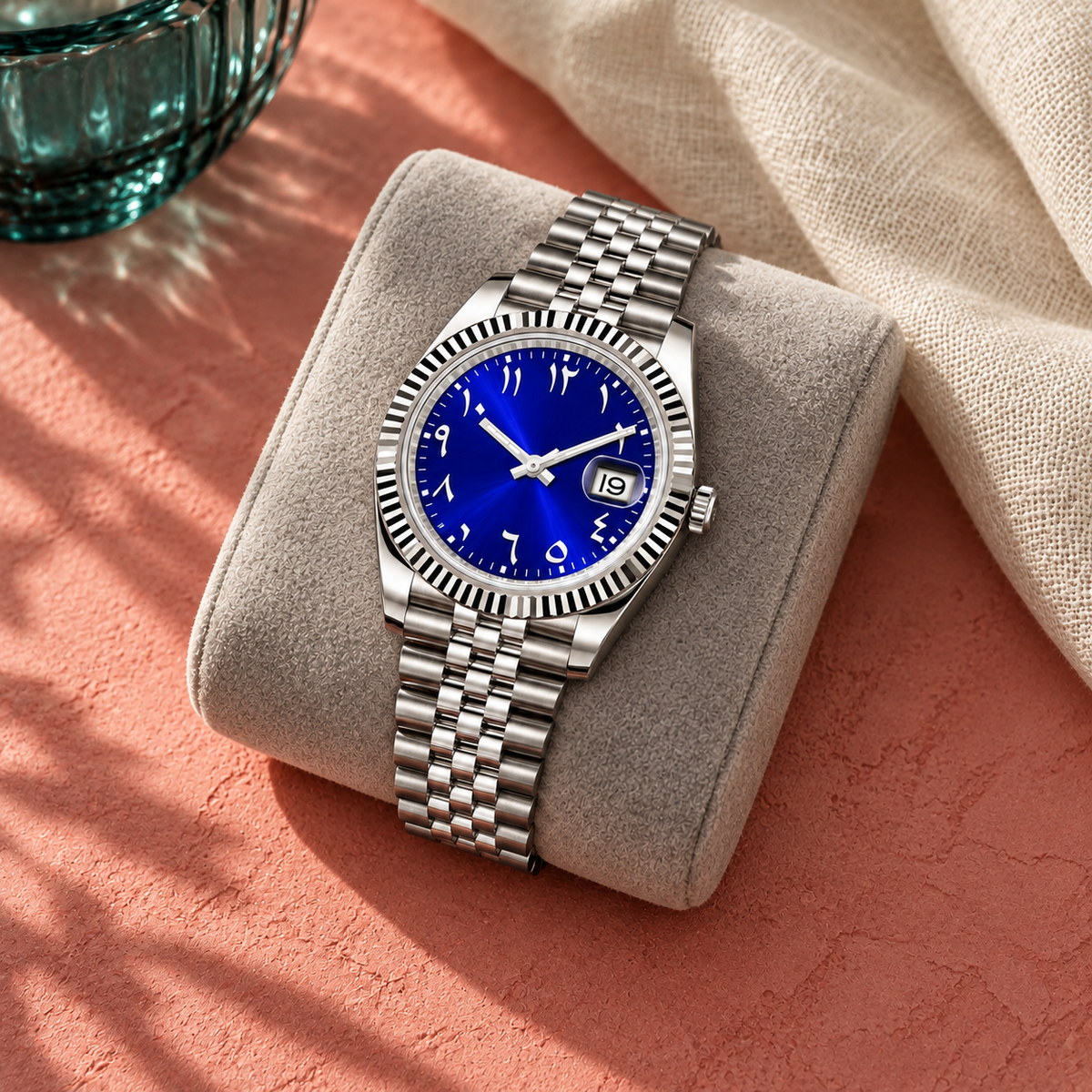 Arabic Heritage royal-blue watch on grey felt against coral plaster