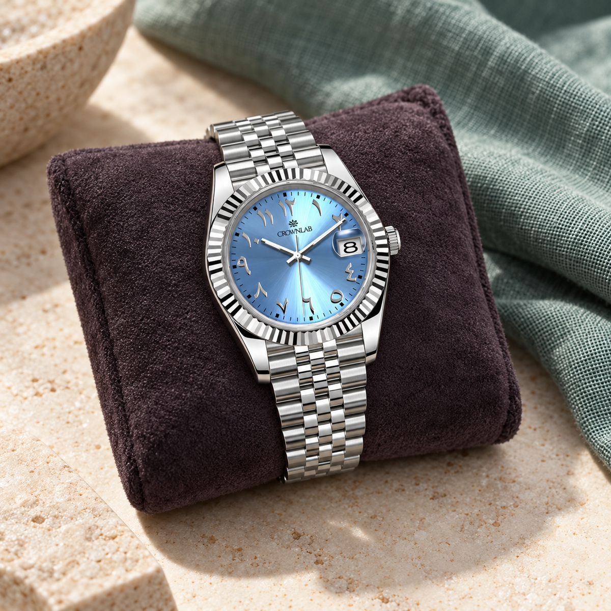Arabic Heritage glacier-blue watch on plum suede with ivory stone