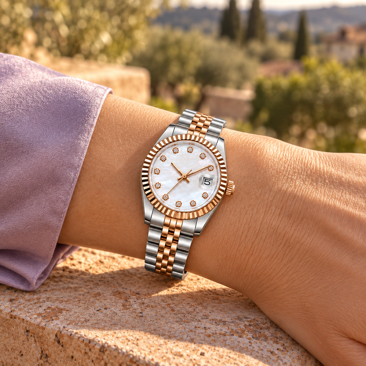 Rose Gold Pearl Crystal watch with lilac cuff against terracotta stone