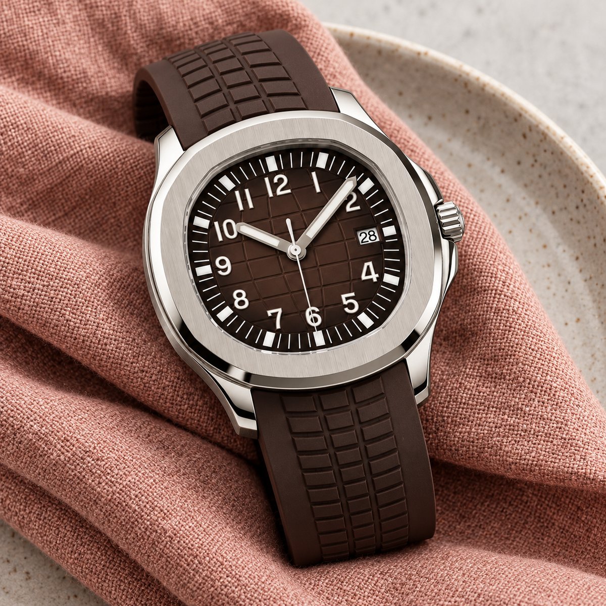 Nautiko Sienna Brown resting on dusty-rose linen and pale ceramic