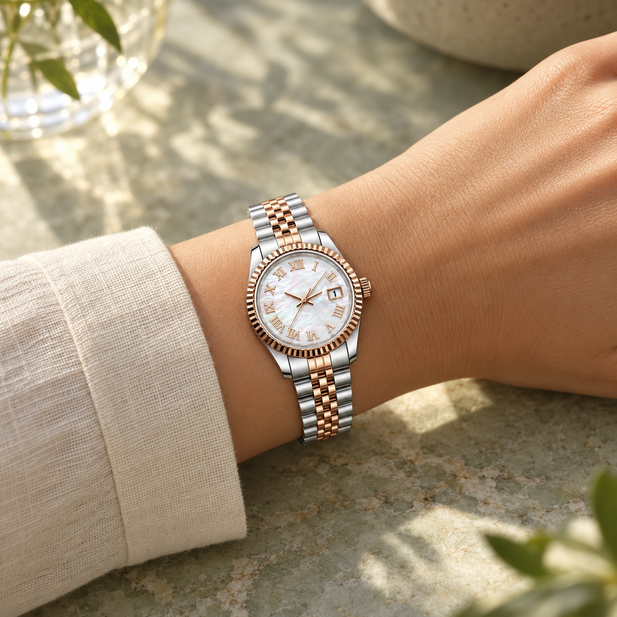 Lady Crownline Rose Gold Mother of Pearl Roman watch worn with cream linen cuff