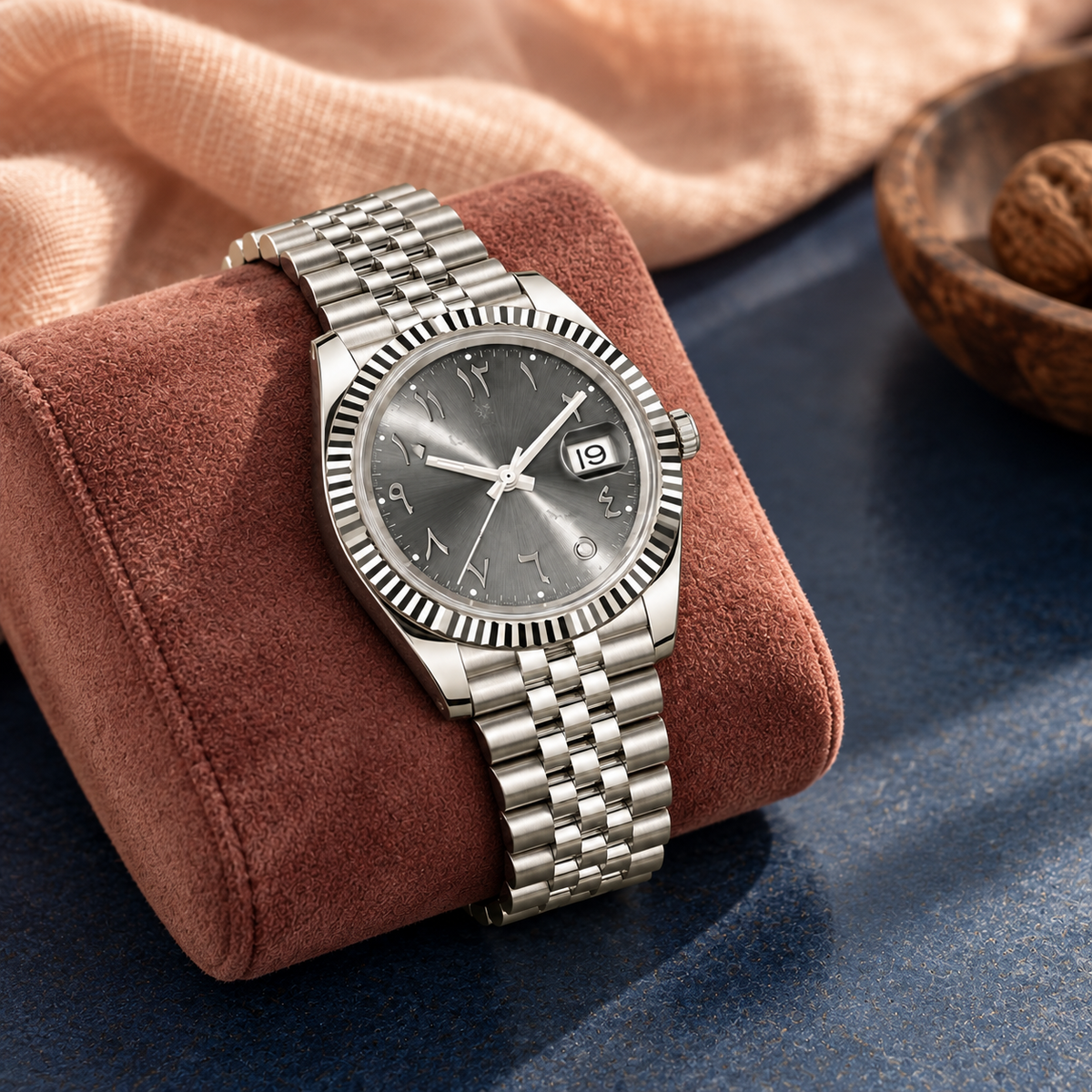 Arabic Heritage slate-grey watch on rose suede over navy ceramic