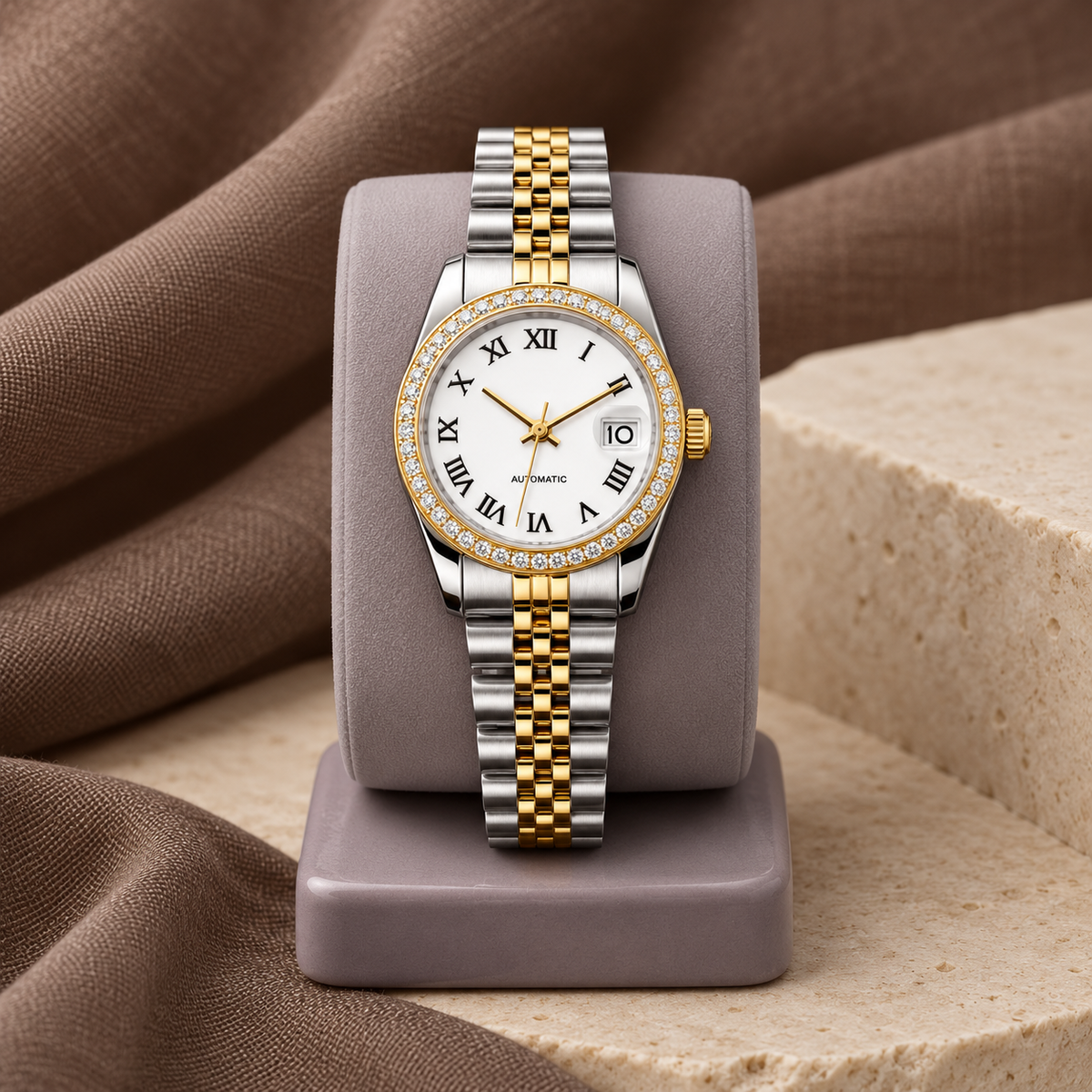 Lady Crownline Two-Tone White Roman Crystal watch upright on a lavender-grey stand with taupe linen