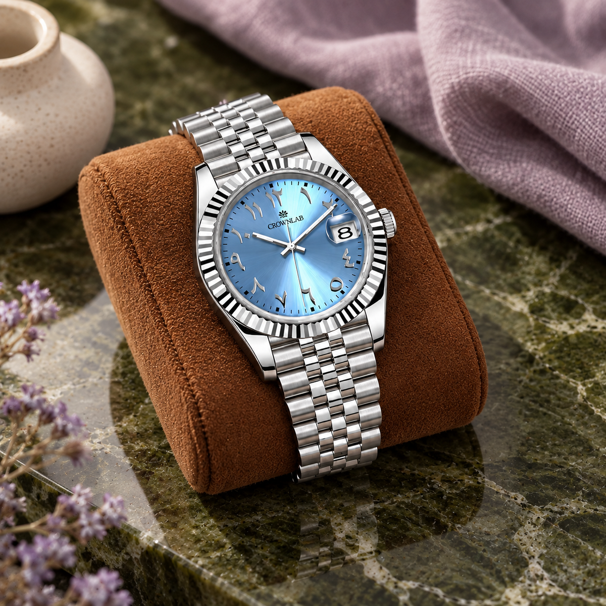 Arabic Heritage glacier-blue watch on cognac suede above olive stone