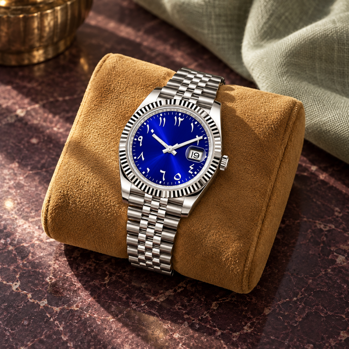 Arabic Heritage royal-blue watch on ochre suede above plum stone