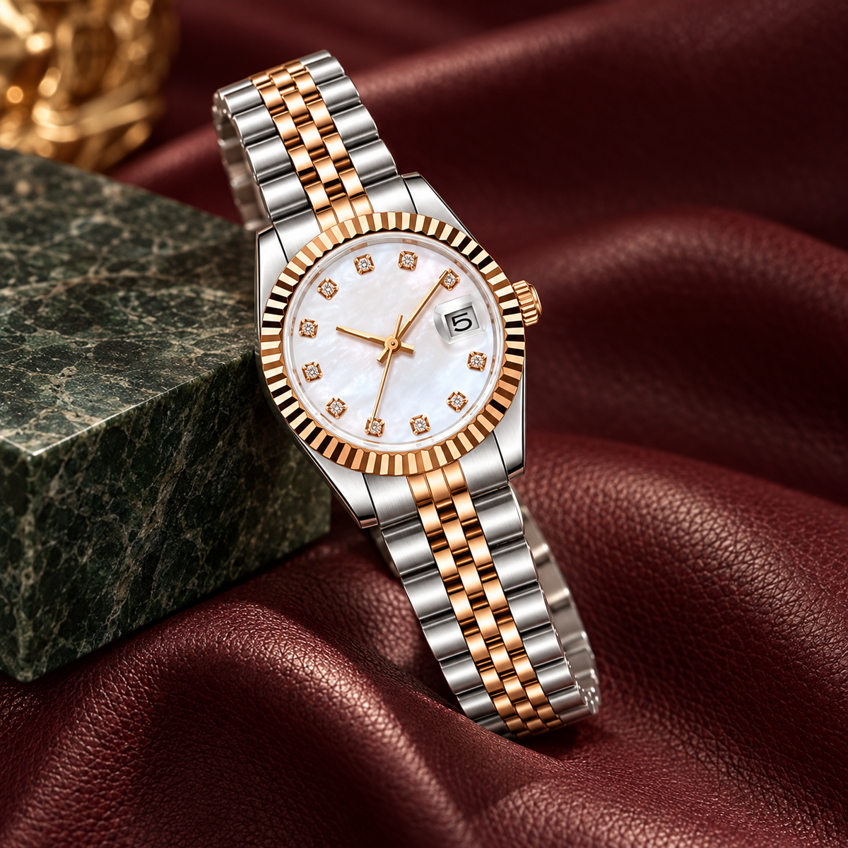 Rose Gold Pearl Crystal watch on burgundy leather and dark green stone