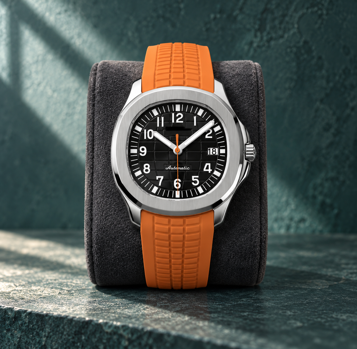 Nautiko Black & Orange automatic watch upright on a charcoal display cushion