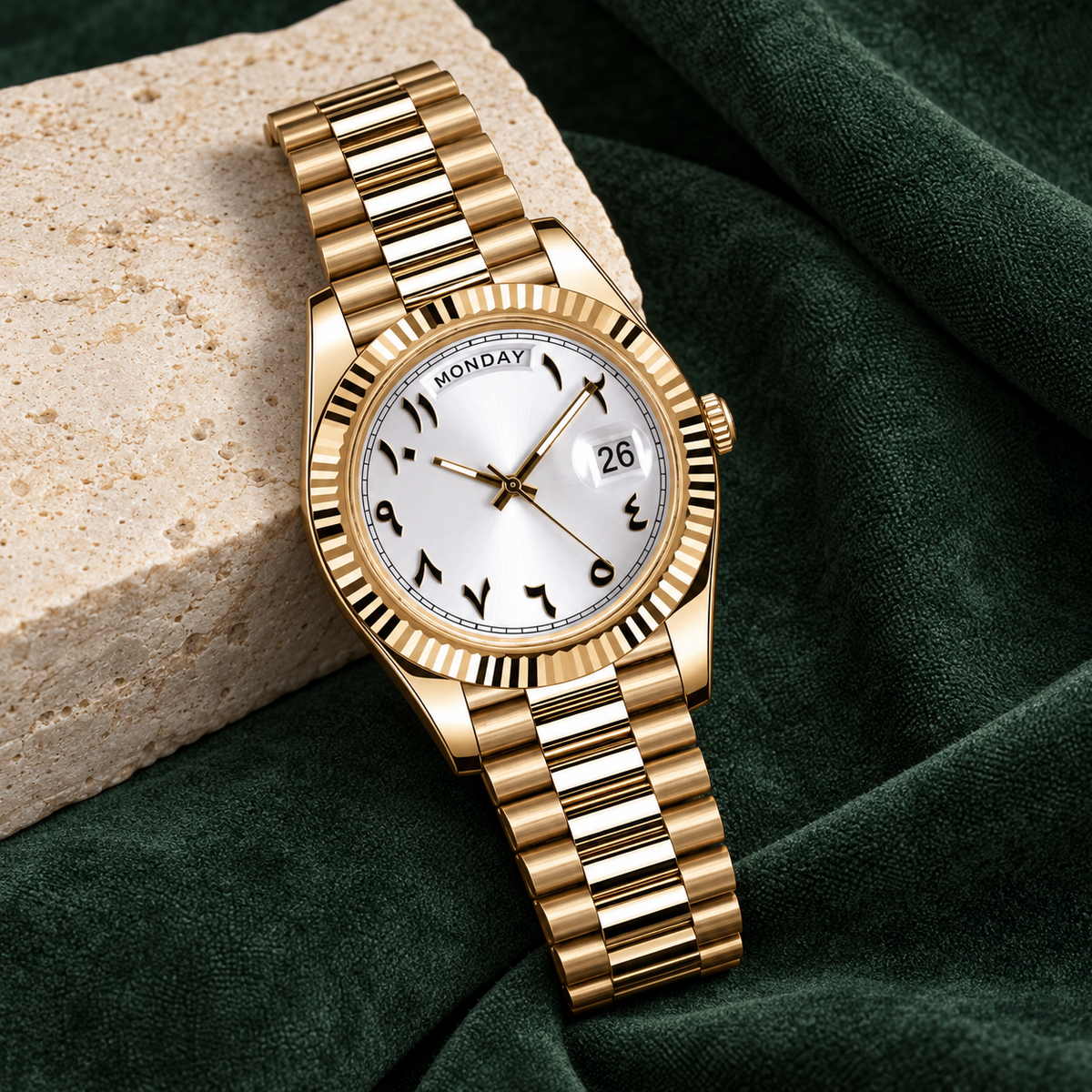 Dayline Gold Arabic White watch laid diagonally on forest suede and limestone