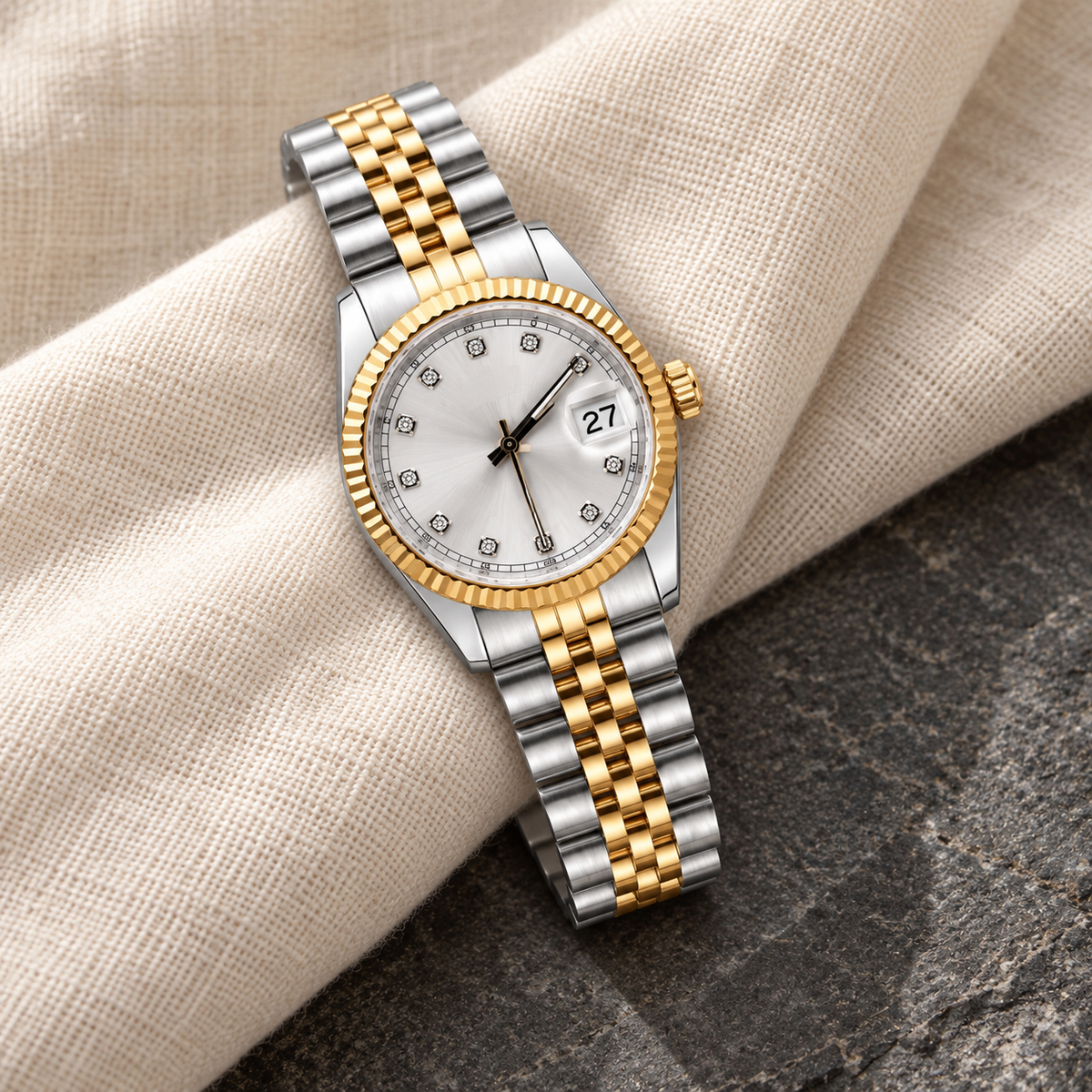 Lady Crownline Two-Tone Silver Crystal watch with gold-and-steel Jubilee bracelet on ivory linen and charcoal stone