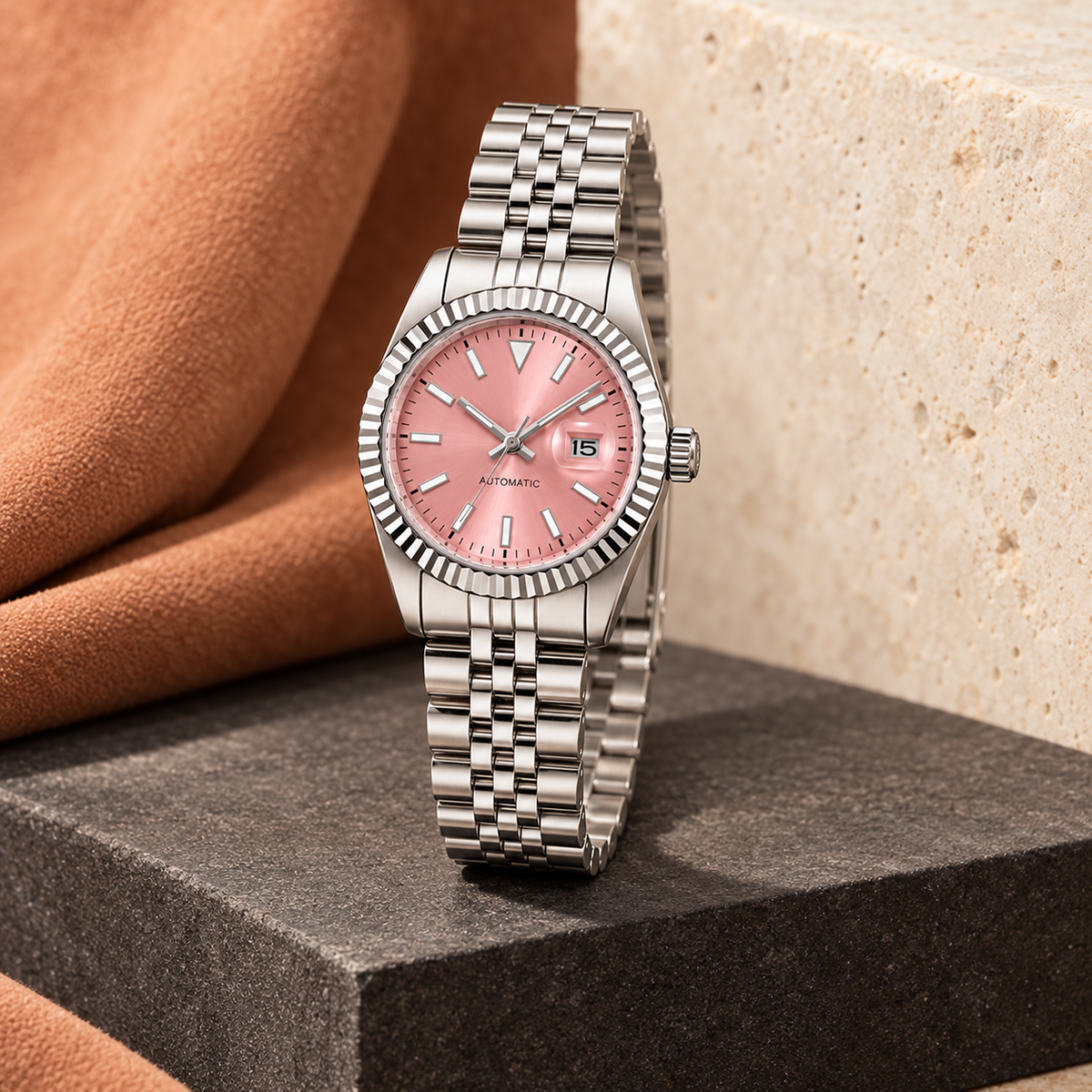 Lady Crownline Pink Dial watch showing the crown and case on charcoal stone