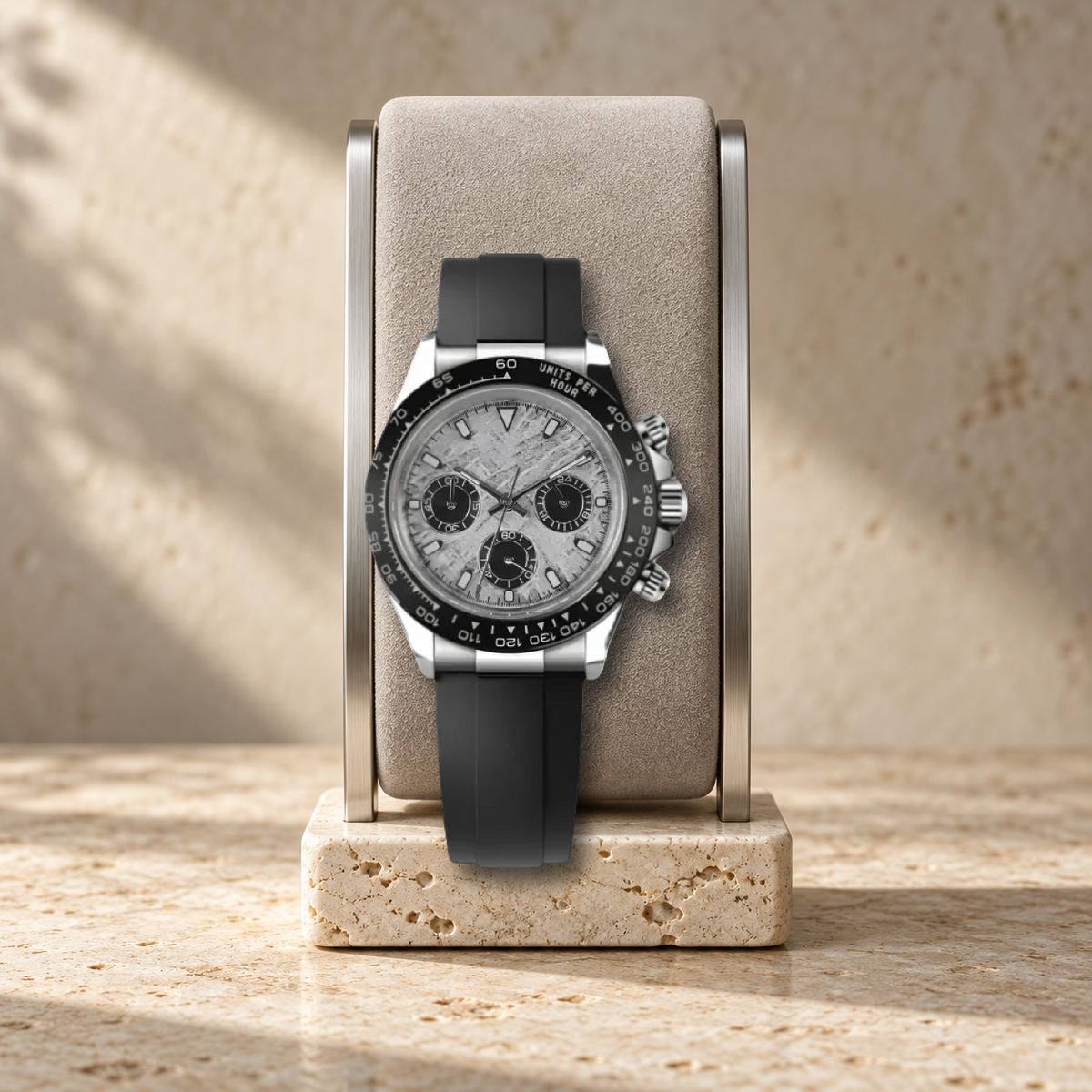 Meteorite Sport VK63 chronograph, properly scaled on pale suede cushion and travertine watch stand