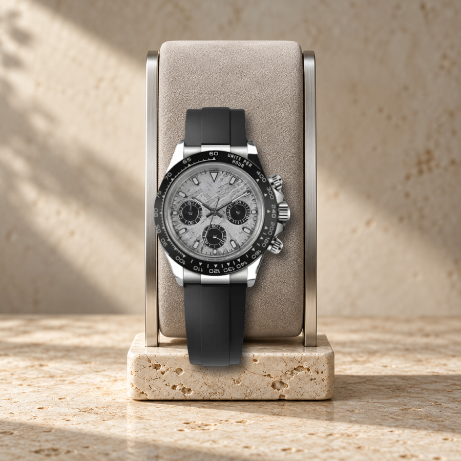 Meteorite Sport VK63 chronograph, properly scaled on pale suede cushion and travertine watch stand