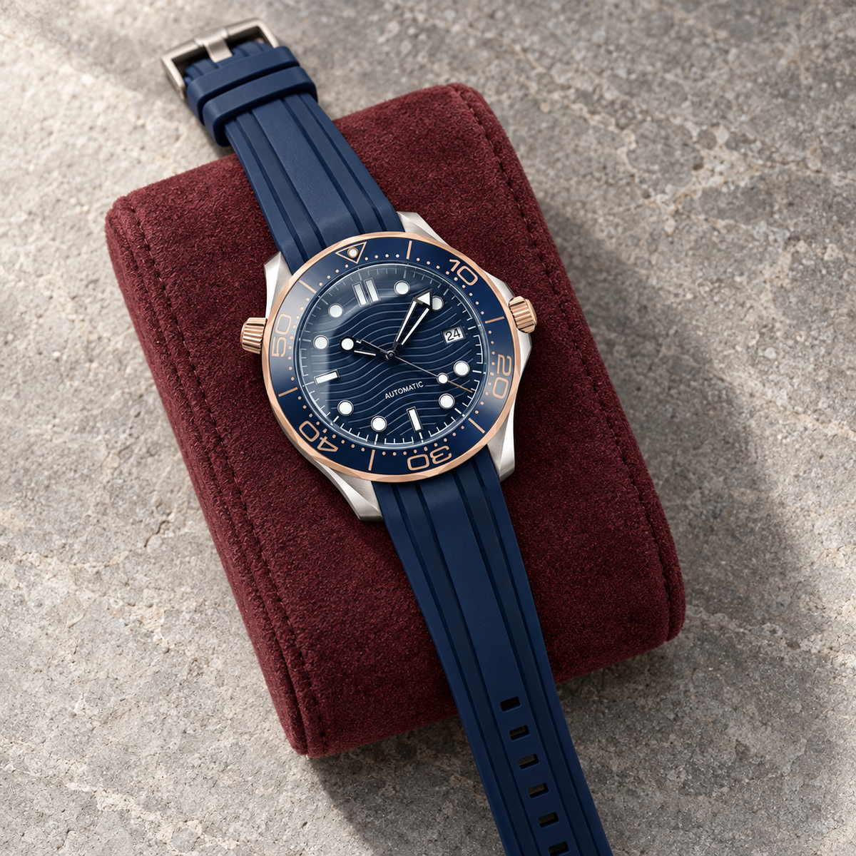 Oceanline Diver Prestige laid on a burgundy cushion over limestone