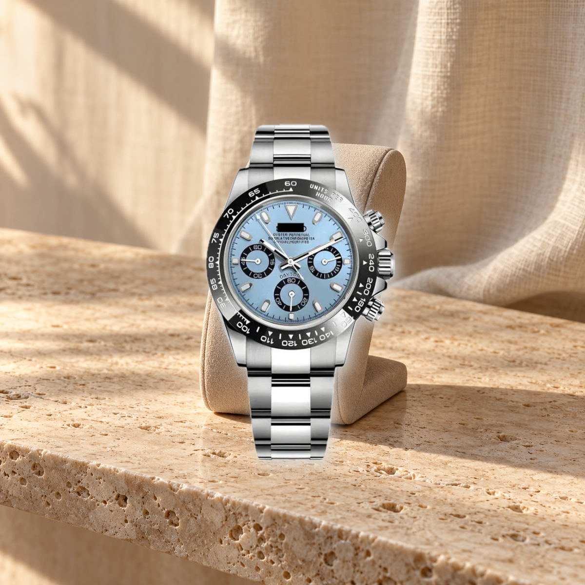 Sky-blue chronograph on warm travertine display