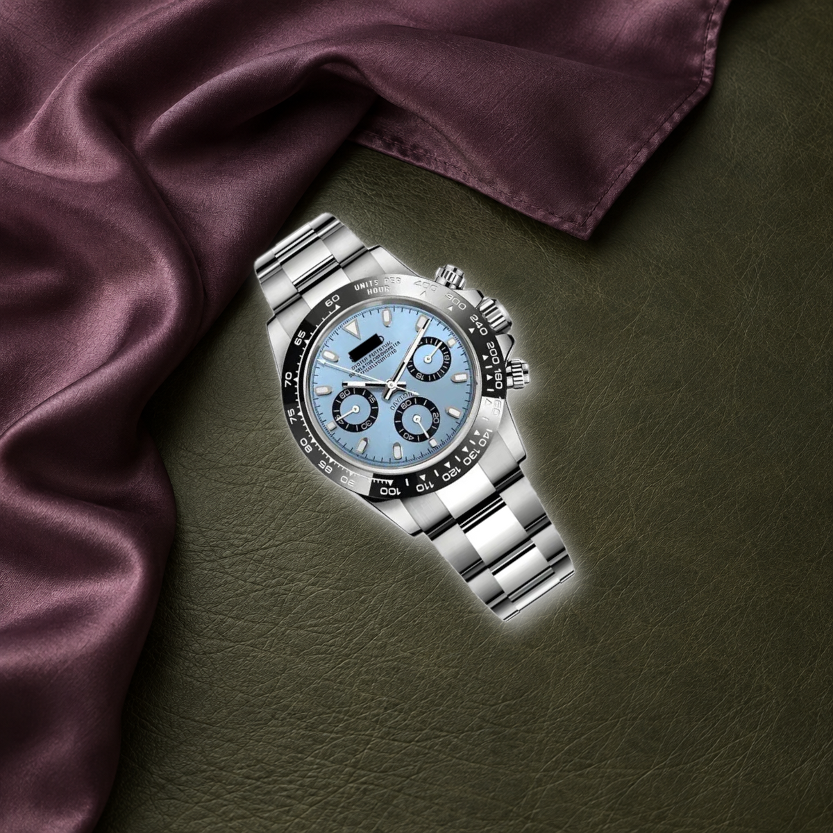 Sky-blue chronograph laid on plum silk and olive leather