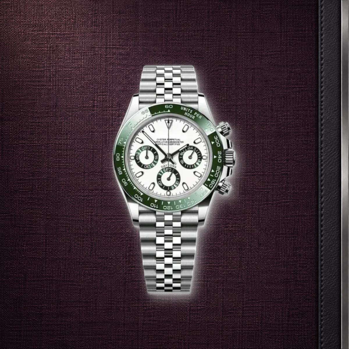 Speedline Alpine Green Racer chronograph lying face-up on aubergine linen and charcoal leather