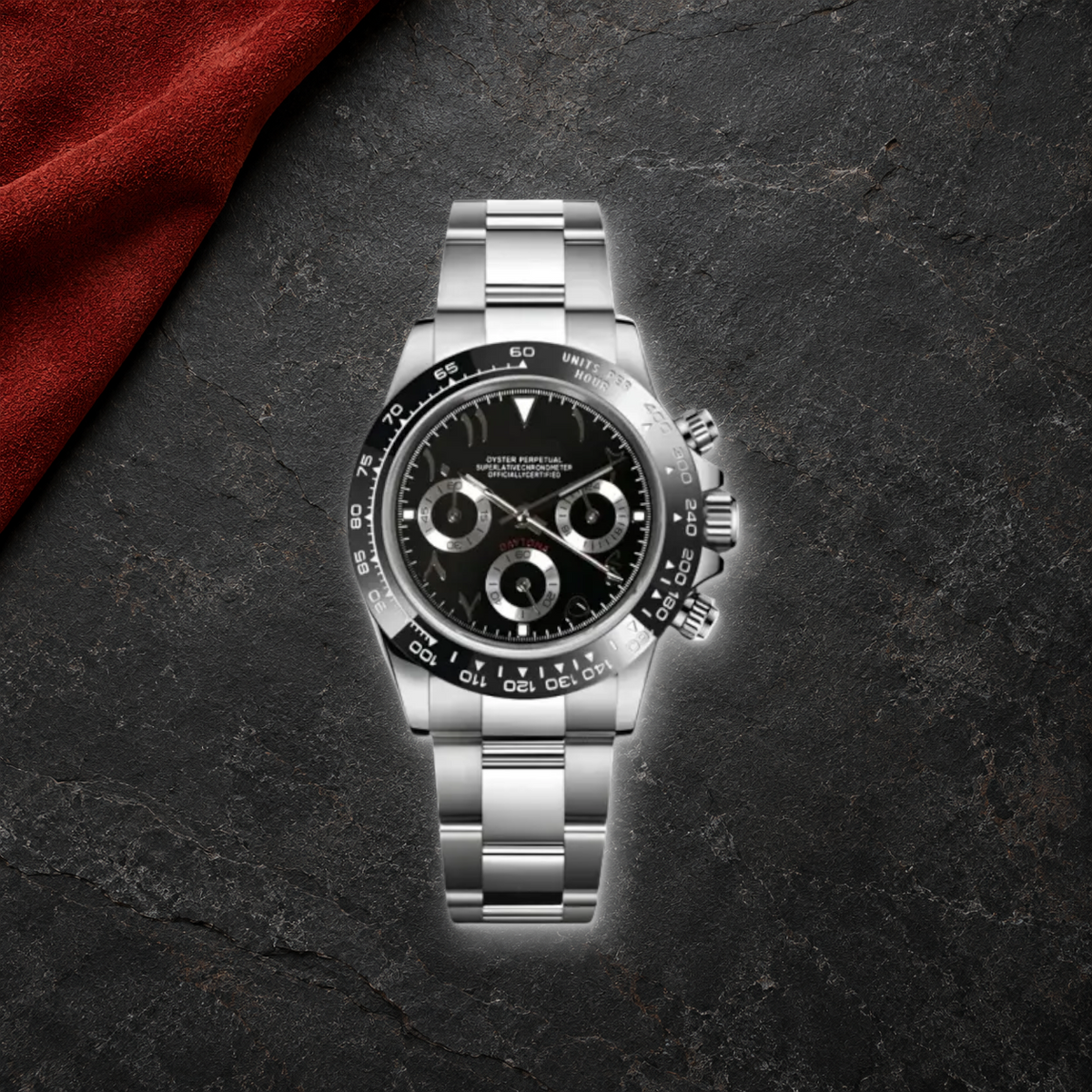 Speedline Arabic Black Racer chronograph lying face-up on charcoal basalt with rust suede