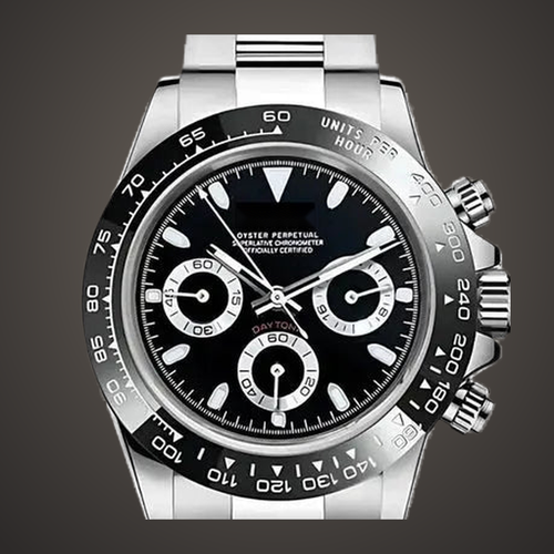 Close-up of the Speedline Chronograph – Stealth Black dial, three chronograph subdials and black tachymeter bezel on a warm stone-toned studio background.
