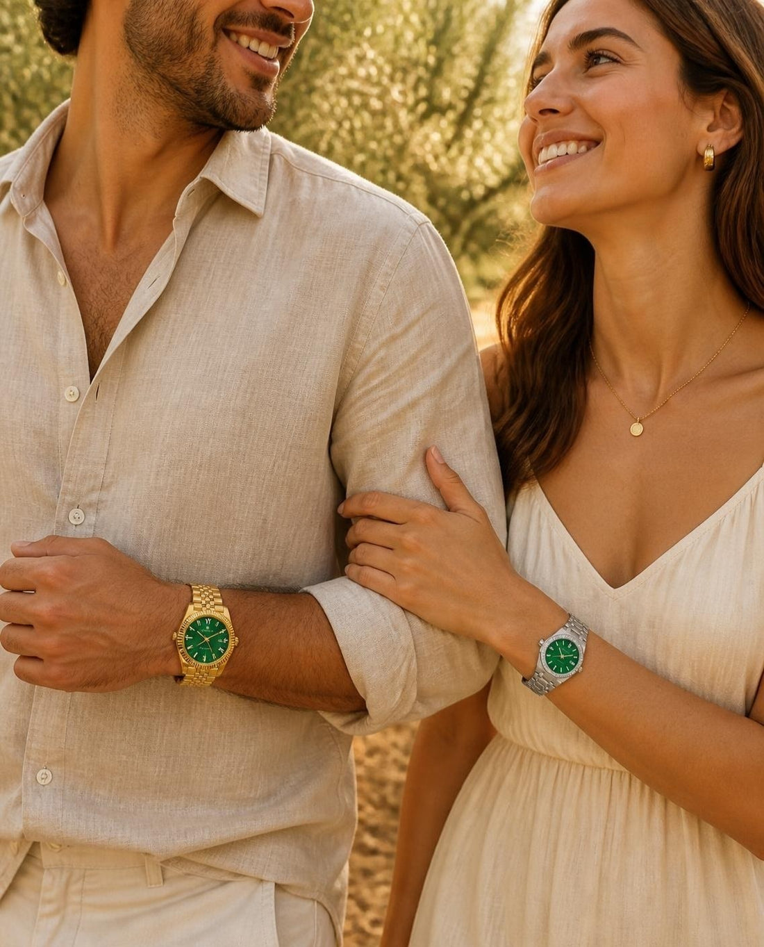 A couple wearing the CrownLab Duet Émeraude matching watches